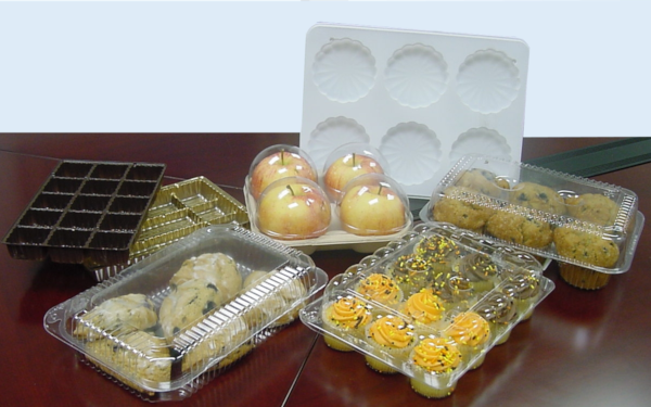 Array of thermoform packaging containing fruits and pastries
