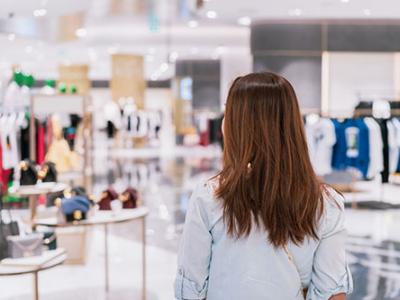 Woman browsing in high-end retail shop
