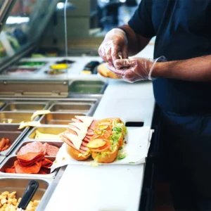supplyone blog case study prepping sandwich wearing gloves